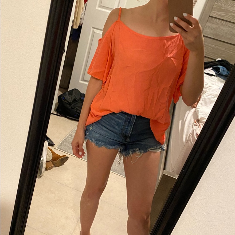 Cute summer top. Open lower back. Coral color